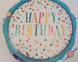 Party pinata with happy birthday sign